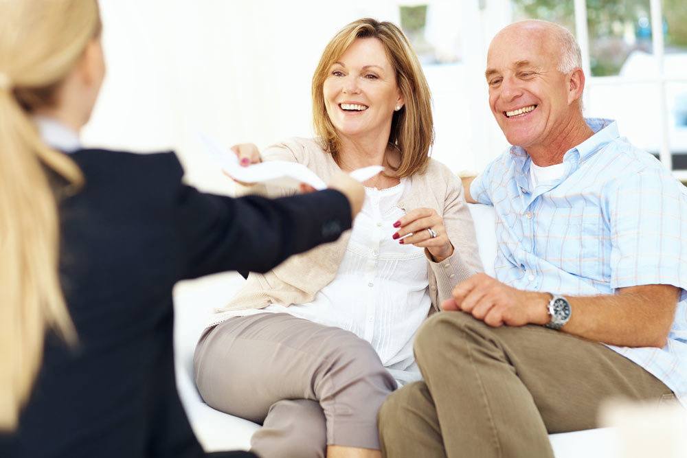 Insurance agent with senior couple Insurance agent with senior couple